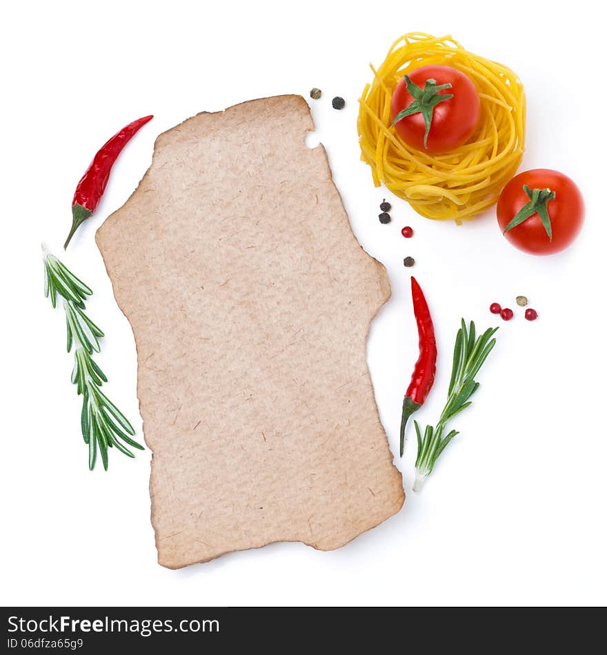 Pasta, tomatoes, spices and a piece of paper to write the recipe, isolated on white