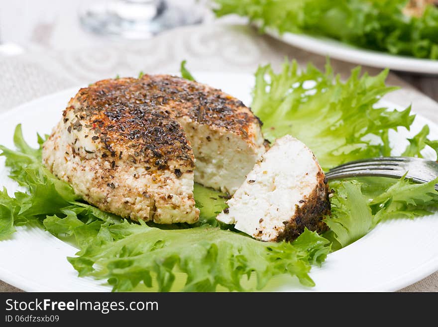 Spicy baked homemade cheese and fresh salad