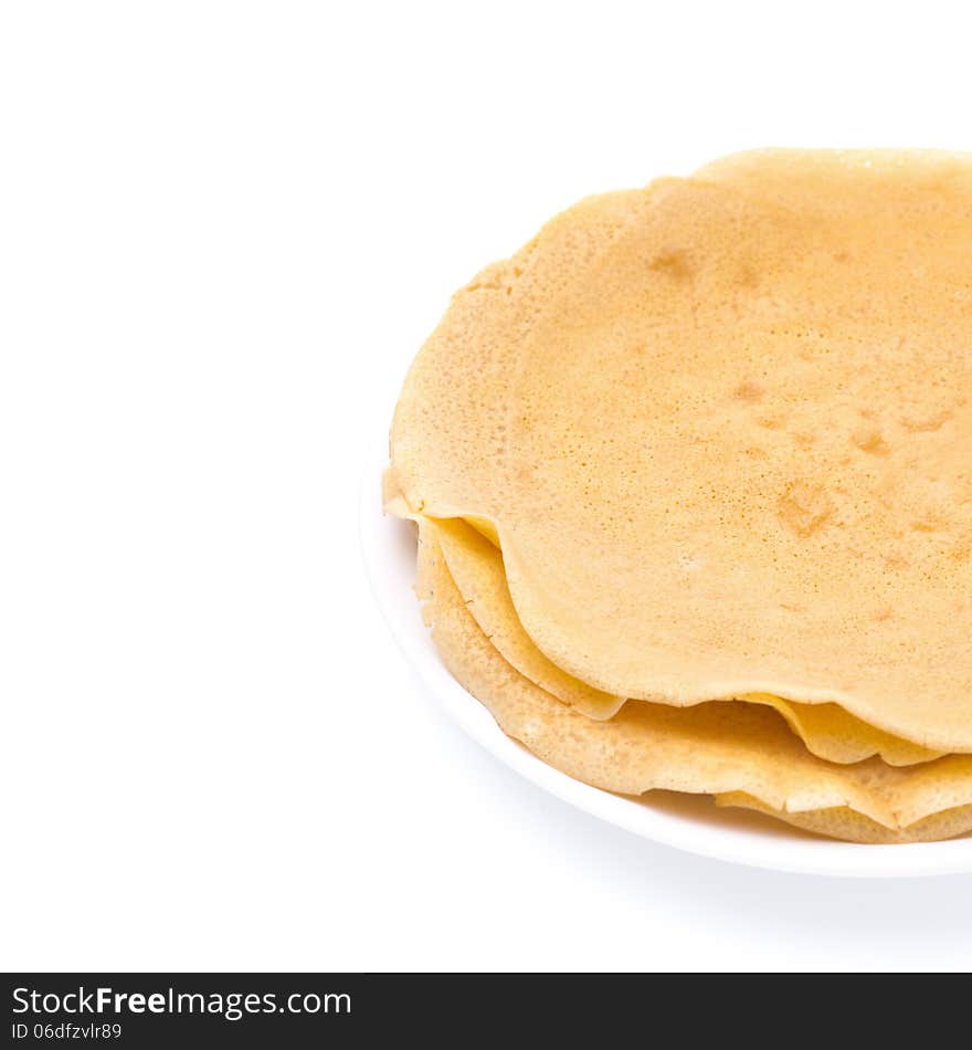 Stack of crepes on a plate, isolated