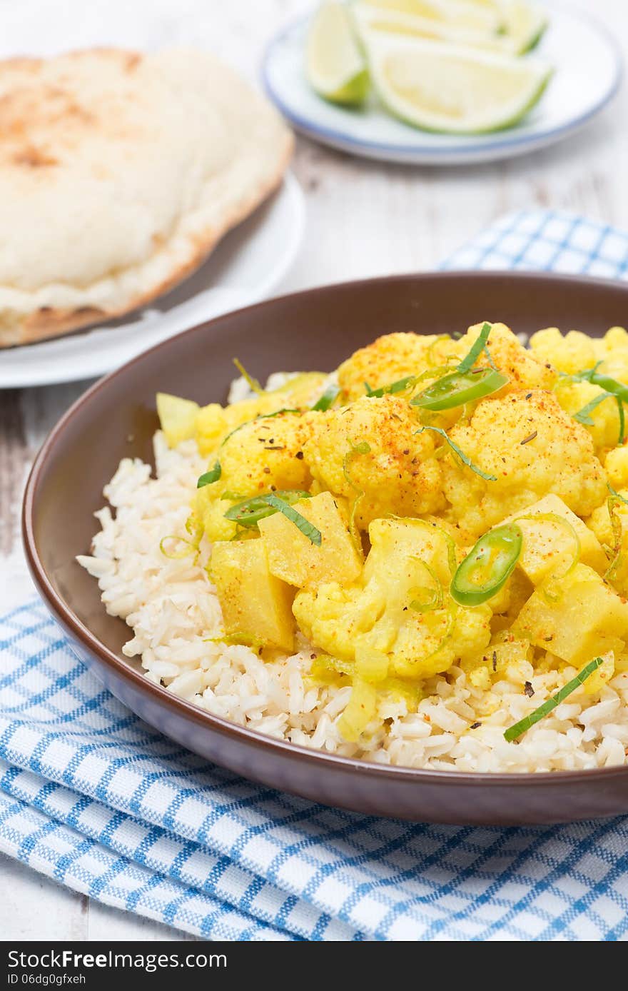 Vegetable curry with cauliflower and rice, close-up, vertical