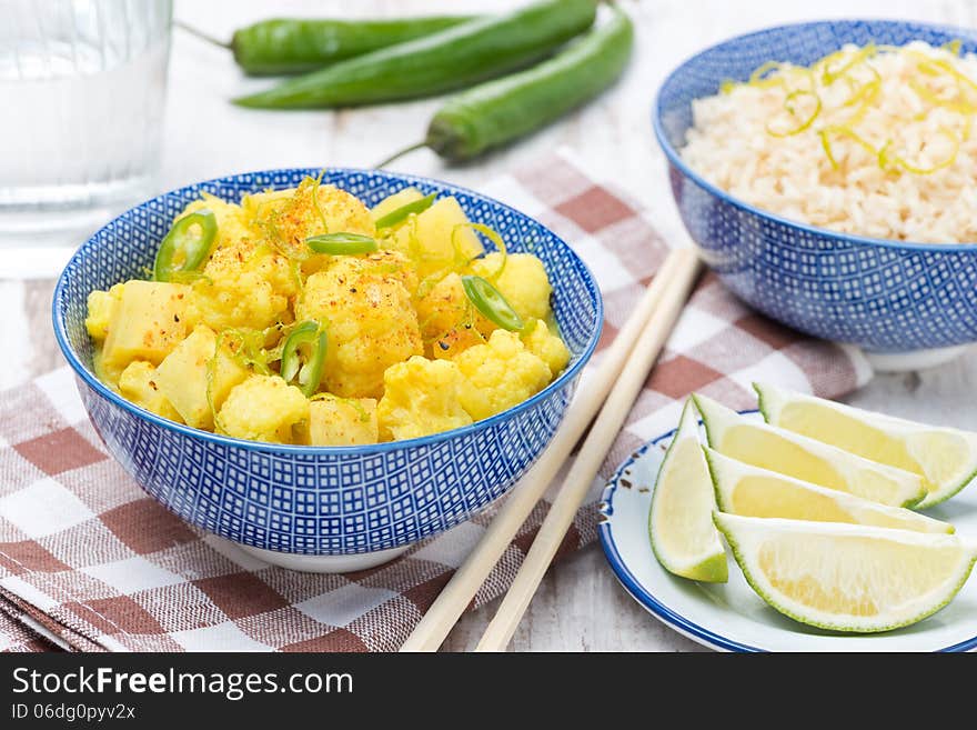 Vegetable curry with lime and mint in a bowl, close-up