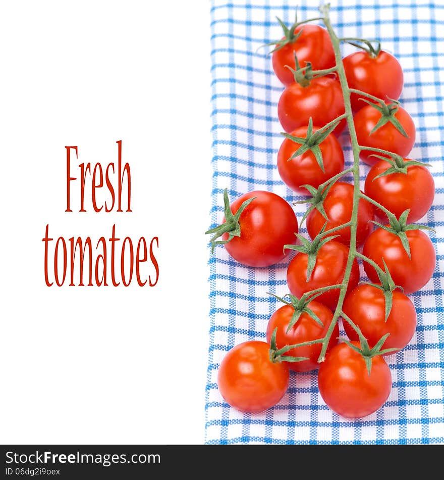 Cherry tomatoes on a blue napkin, isolated