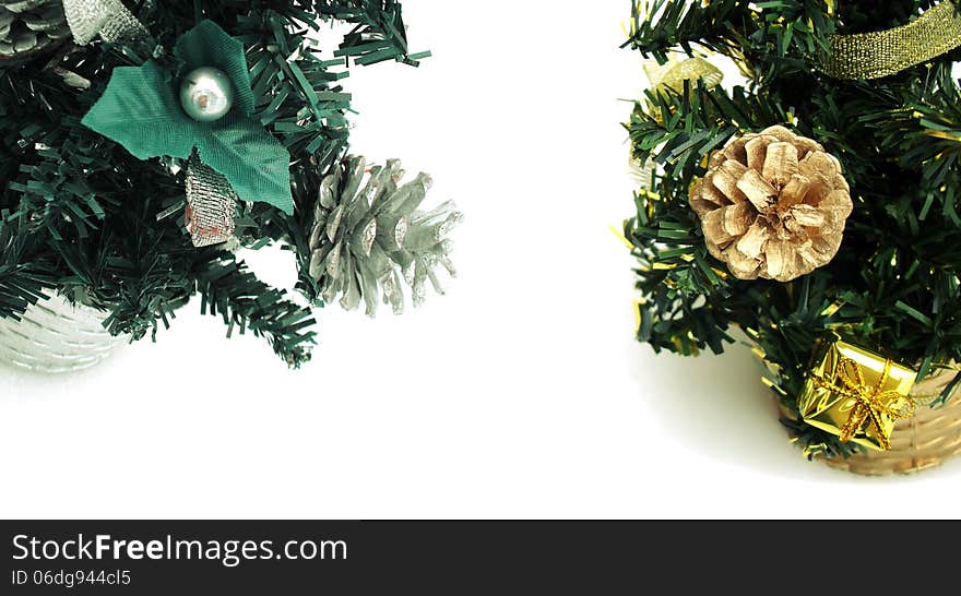 Fake new year trees and Cones in pine on white background.