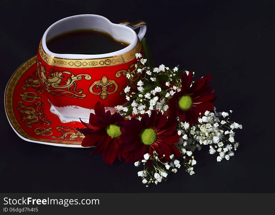 Cup of coffee and flowers