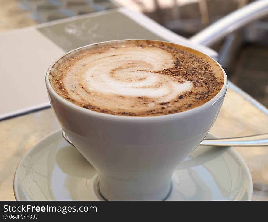 Hot cup of Cappuccino Coffee served in a cafe Italy