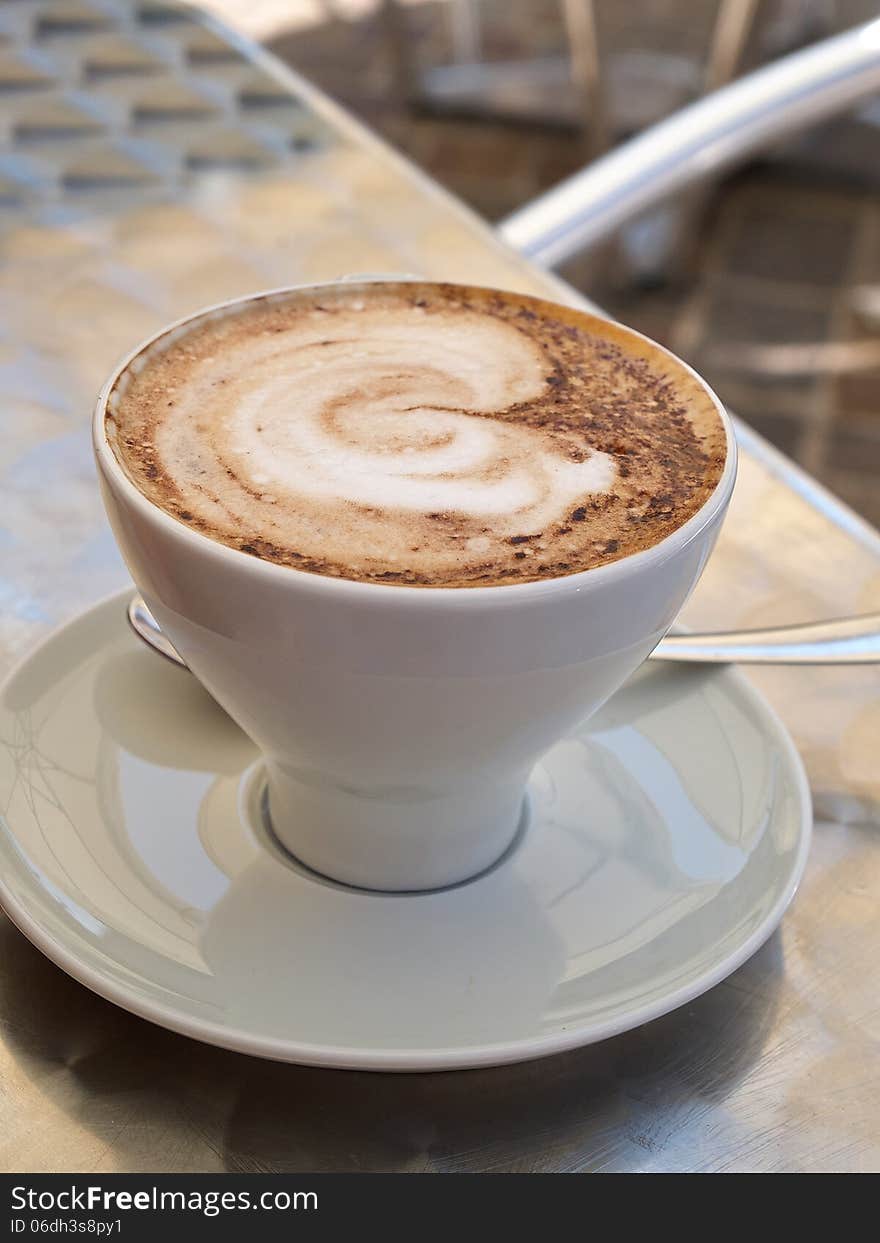 Hot cup of Cappuccino Coffee served in a cafe Italy