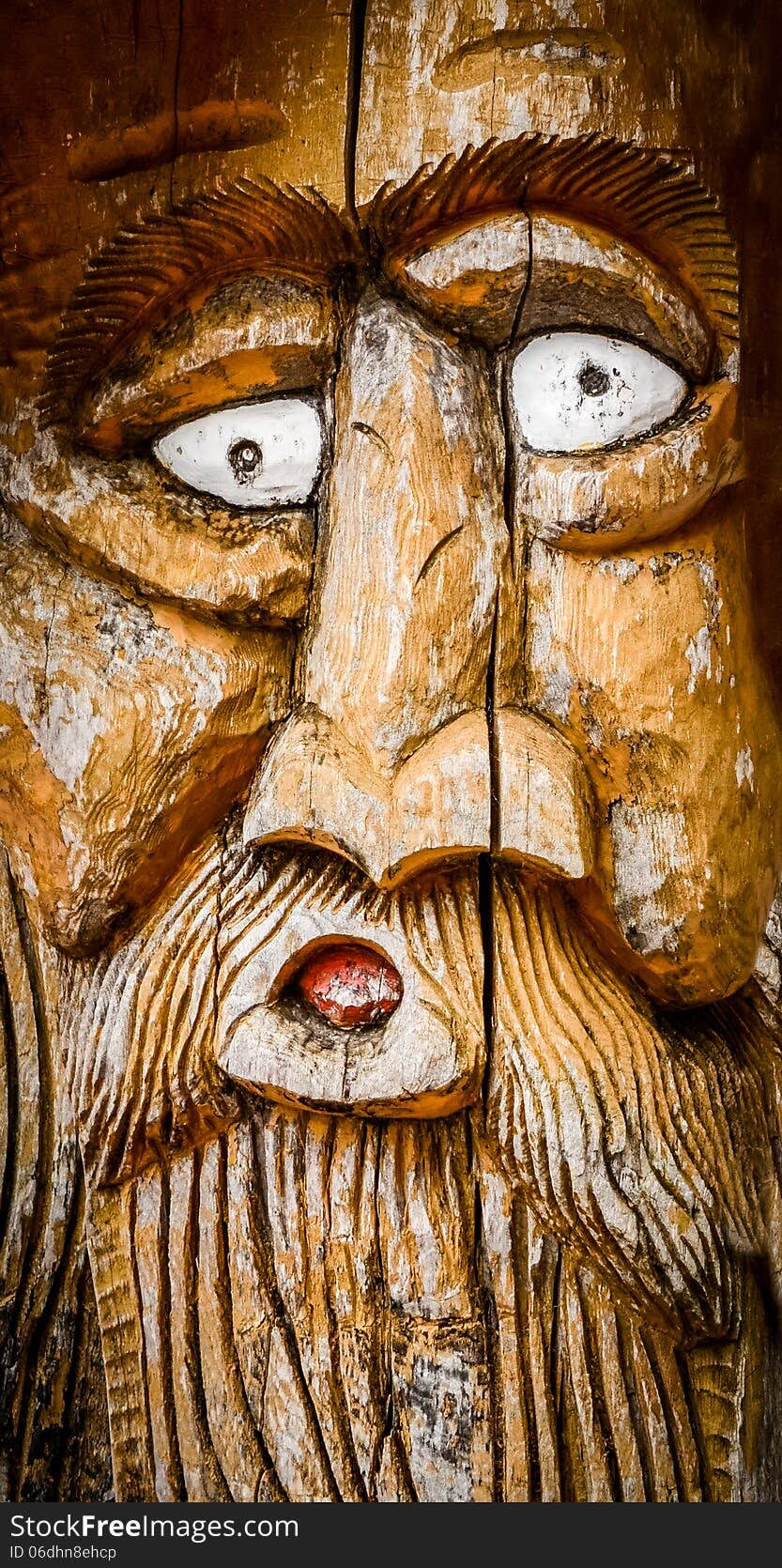 Detail Of A Man's Face With A Beard Carved Into Wood. Detail Of A Man's Face With A Beard Carved Into Wood