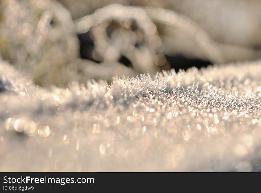 Closeup on frost formed knew a piece of metal