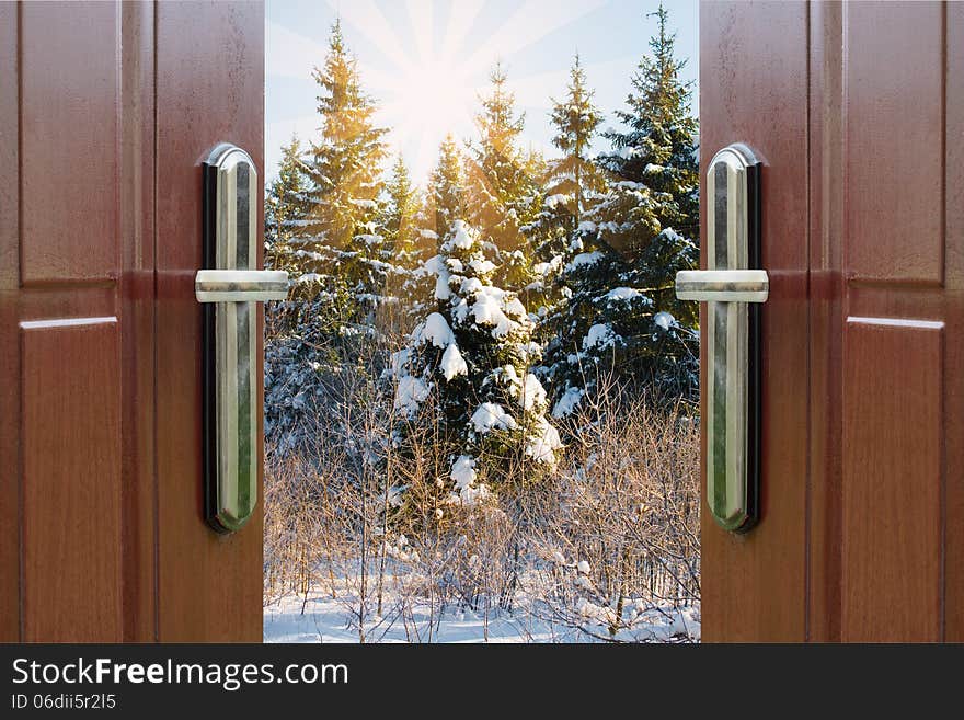 Open door with a view of green meadow illuminated by bright sunshine. Open door with a view of green meadow illuminated by bright sunshine