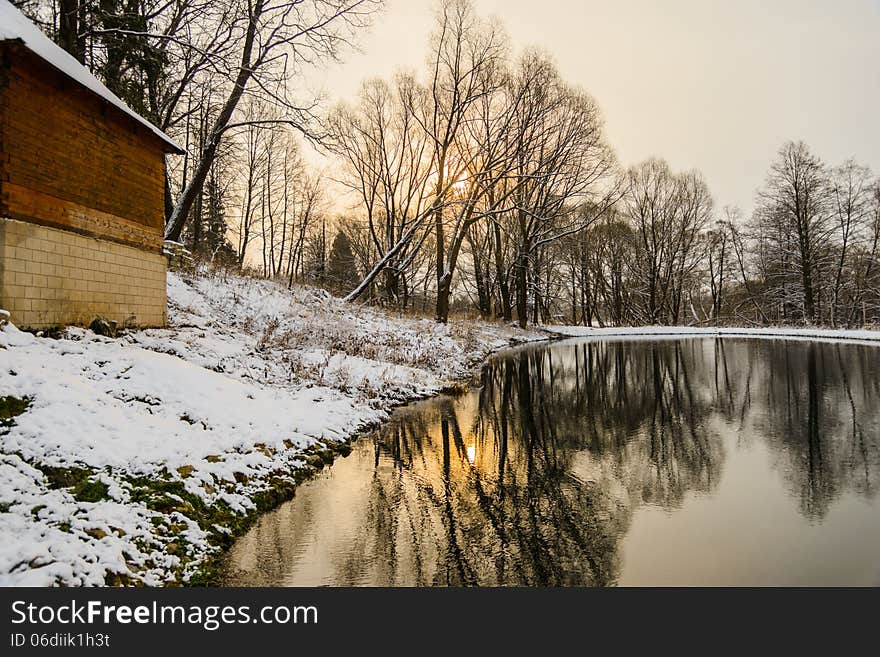 Not frozen pond in winter