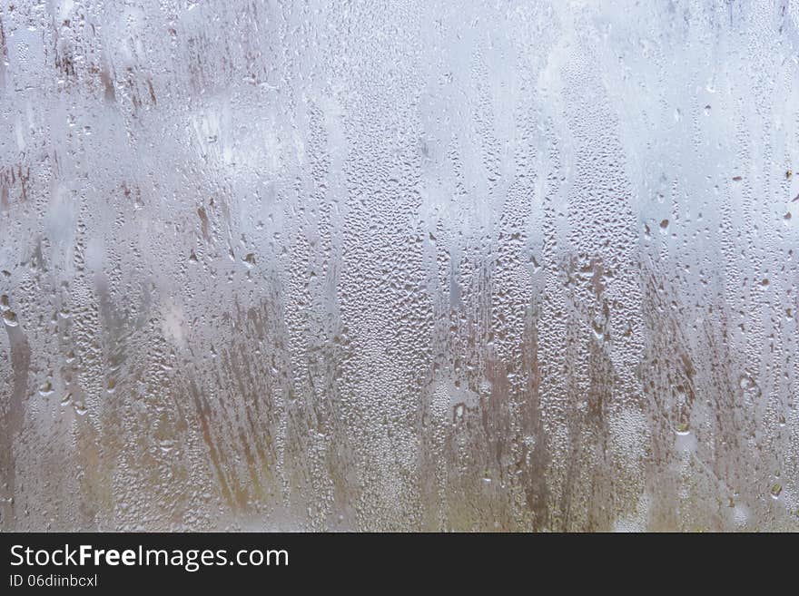 Rain drops on glass with a background. Rain drops on glass with a background