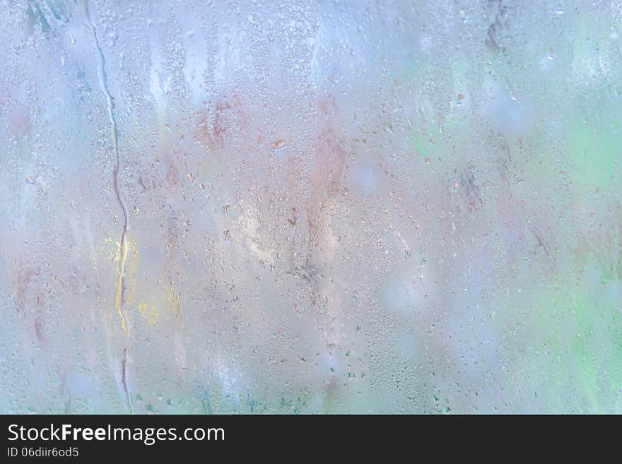 Rain drops on glass with a background. Rain drops on glass with a background