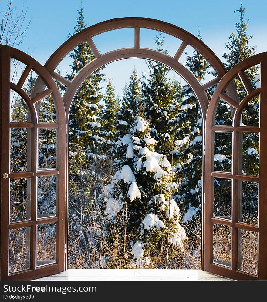 Open arched door with views of the natural landscape