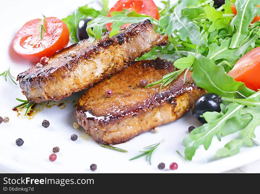 Grilled steaks and vegetables.