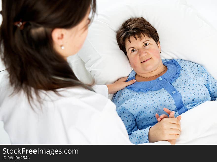 Doctor and patient in hospital room