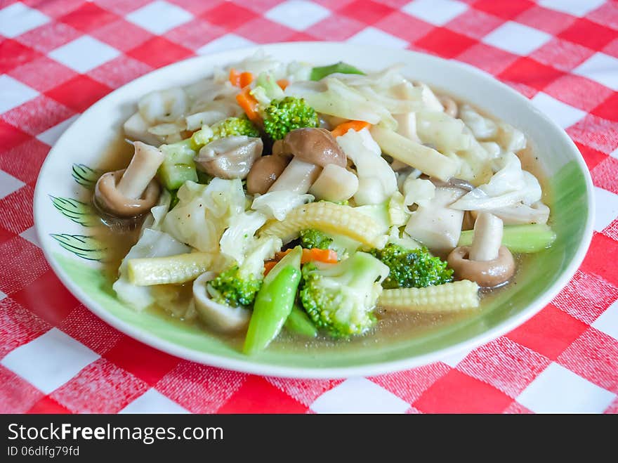 Cooked fresh and crisp vegetables in oyster sauce served in white dish