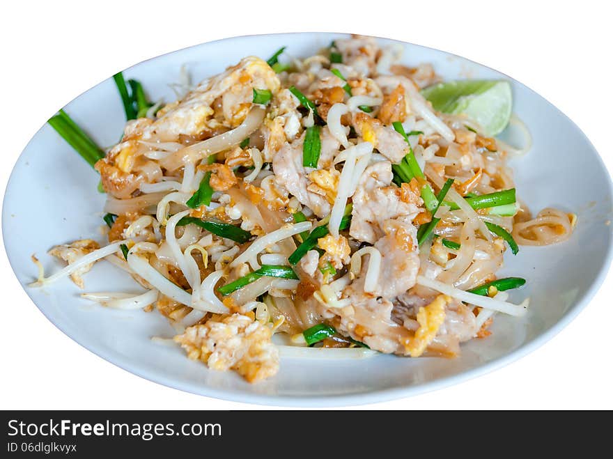 A delicious plate of Pad Thai with shrimp and chicken garnished with cilantro and lime.