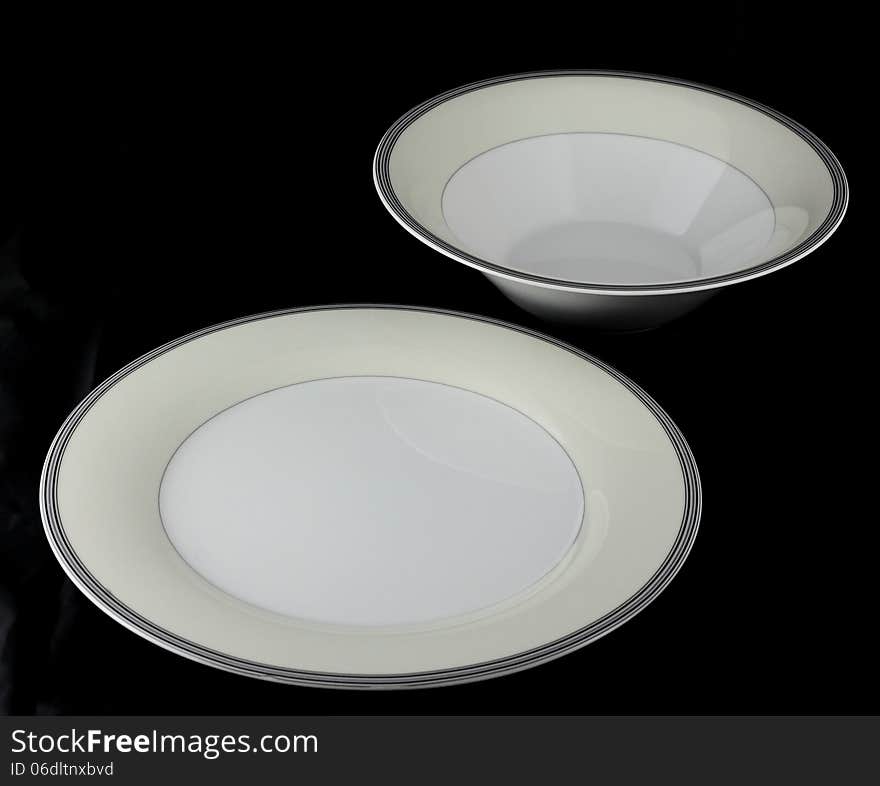 Porcelain serving set on black background. Porcelain serving set on black background.