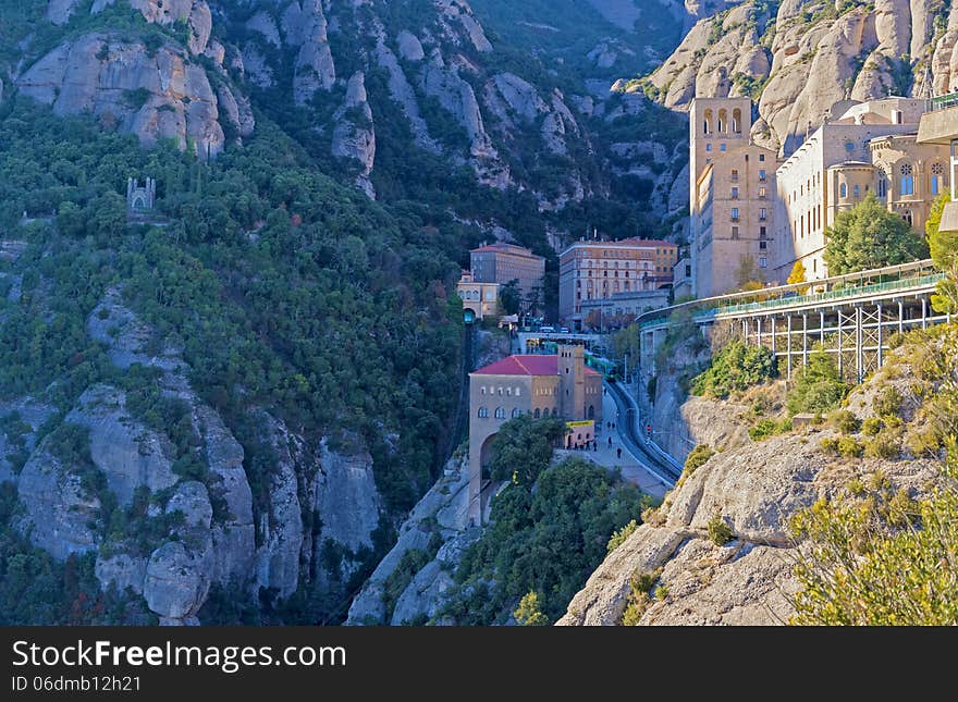 Montserrat, Spain - December 7, 2013: The Benedictine abbey Santa Maria de Montserrat on December 7, 2013 in Monistrol de Montserrat, Spain. It hosts the Virgin of Montserrat, the favorite in Catalonia. Montserrat, Spain - December 7, 2013: The Benedictine abbey Santa Maria de Montserrat on December 7, 2013 in Monistrol de Montserrat, Spain. It hosts the Virgin of Montserrat, the favorite in Catalonia