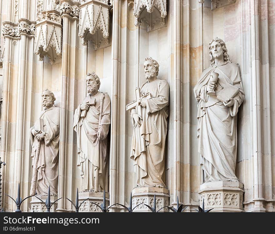 Statues at the entrance into cathedral in Barcelona, Spain.