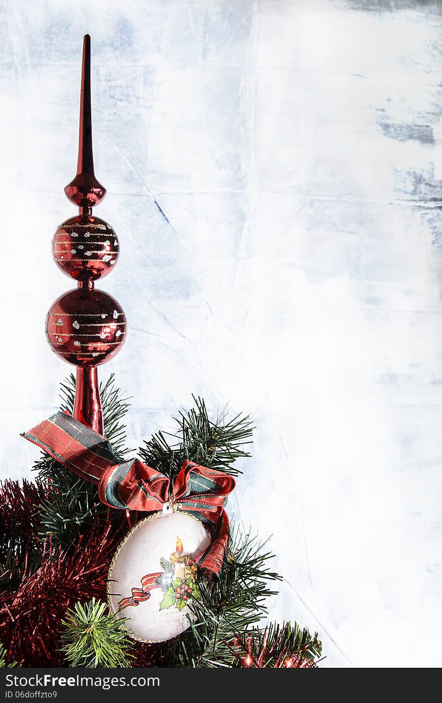 Christmas decoration on the tree with white background and red garlands.