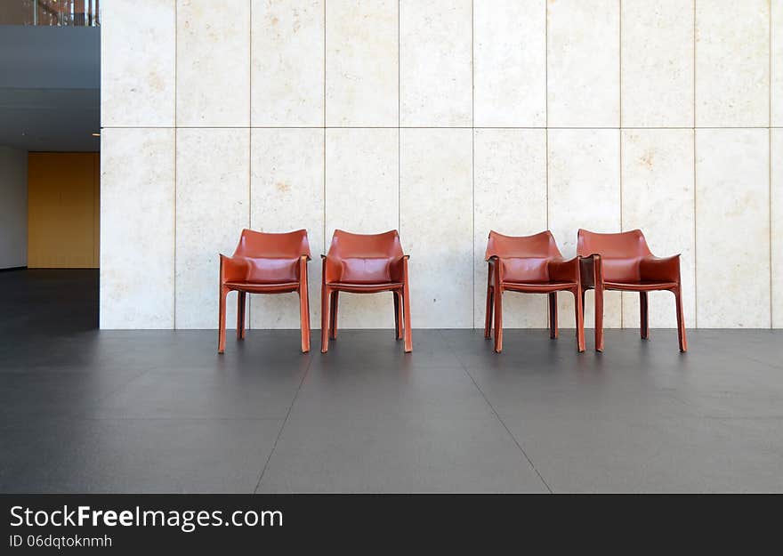 Beautiful interior with modern leather chair on stone floor