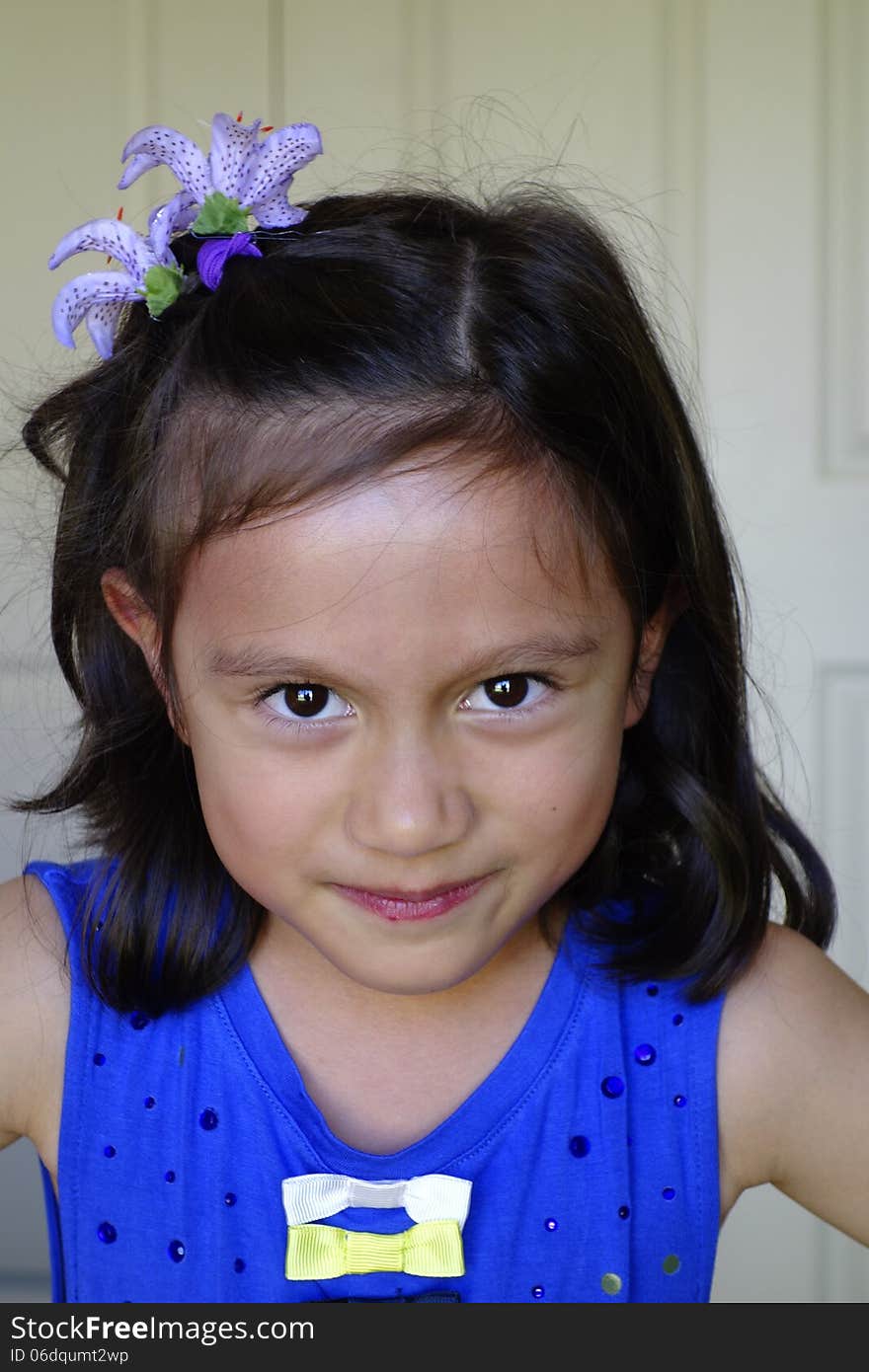 A young girl of asian descent screws up her face showing her displeasure. A young girl of asian descent screws up her face showing her displeasure.