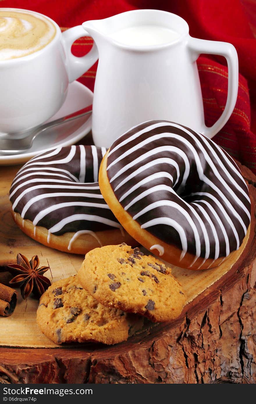 Chocolate donuts and cappuccino