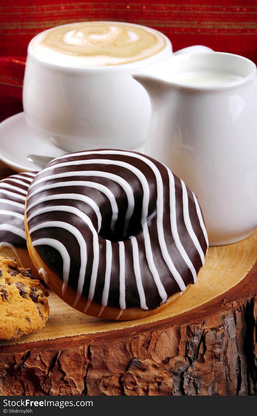 Chocolate donuts and cappuccino