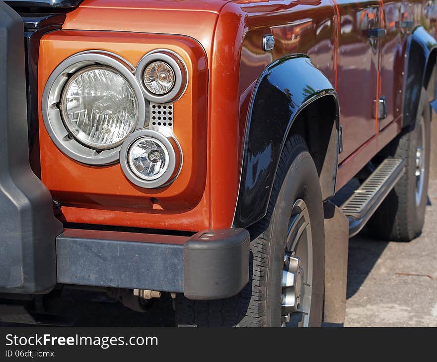 A orange 4x4 off-road car - Detail. A orange 4x4 off-road car - Detail