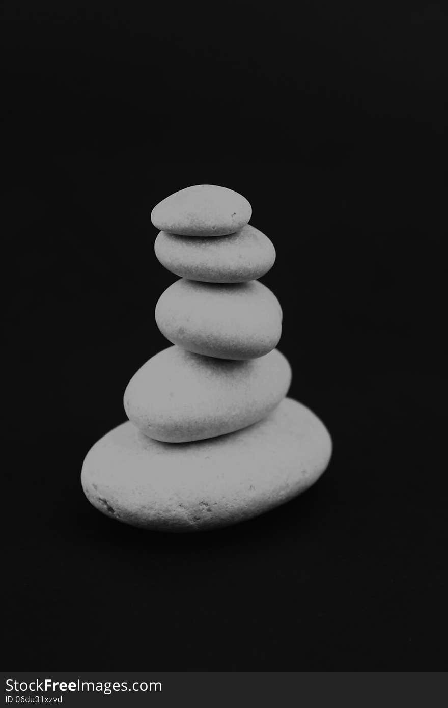 Pyramid of stones on a dark background