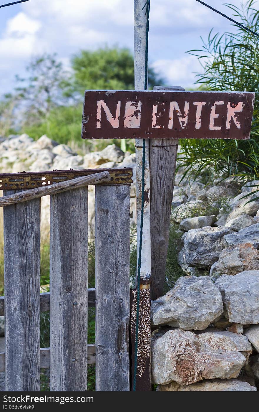 A NO ENTER sign located near a private property in the countryside on the island of Malta. A NO ENTER sign located near a private property in the countryside on the island of Malta