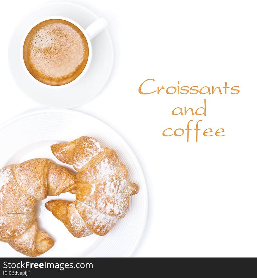 Fresh croissants and cup of coffee isolated, top view