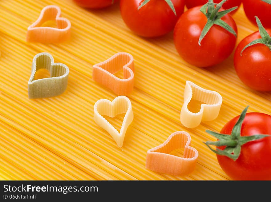 Spaghetti and pasta in the form of heart, close-up