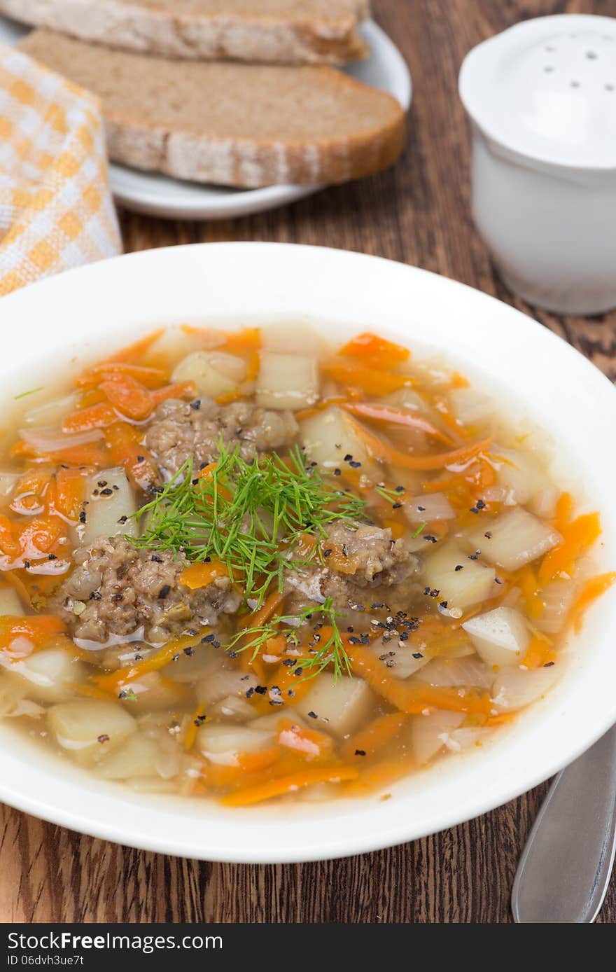 Vegetable soup with meatballs, close-up