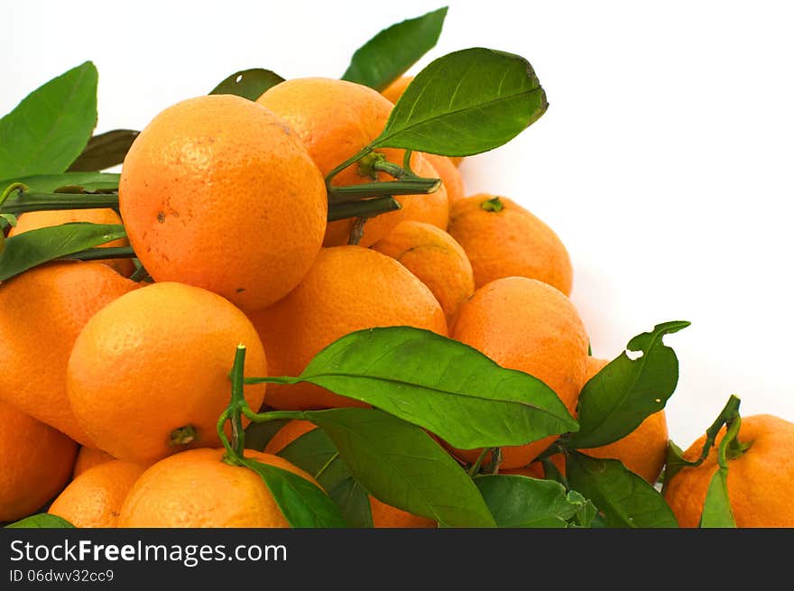 Tangerines With Leaves In The Lower Left Corner