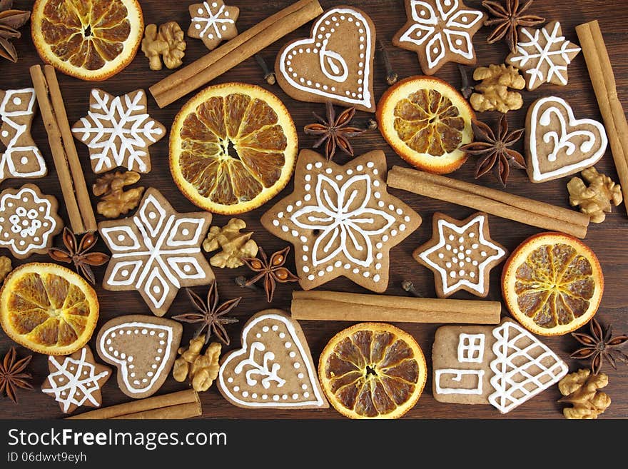 Gingerbread cookies on wooden background. Christmas decoration.