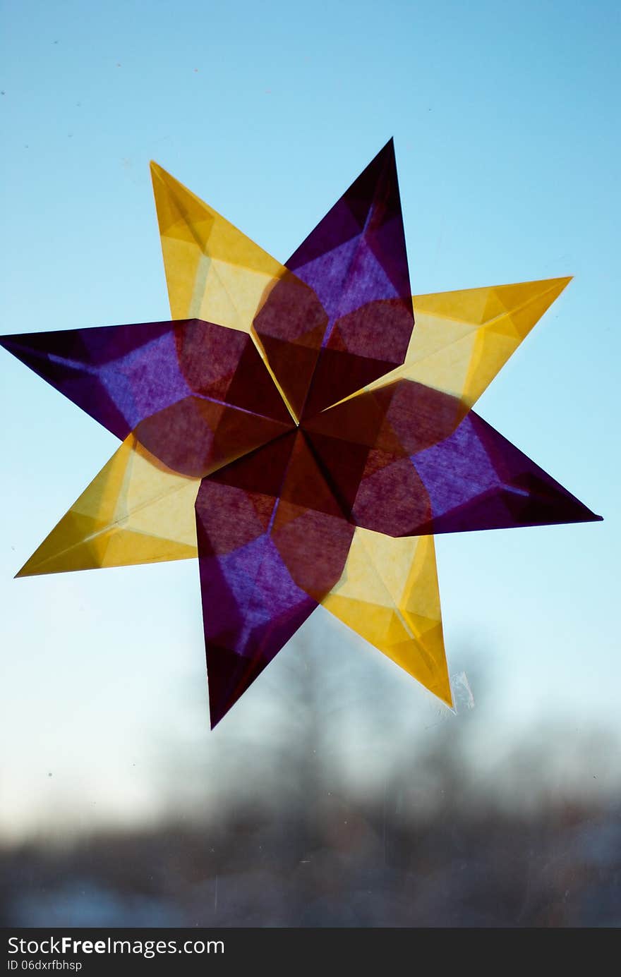 Window decorated with paper star. Window decorated with paper star