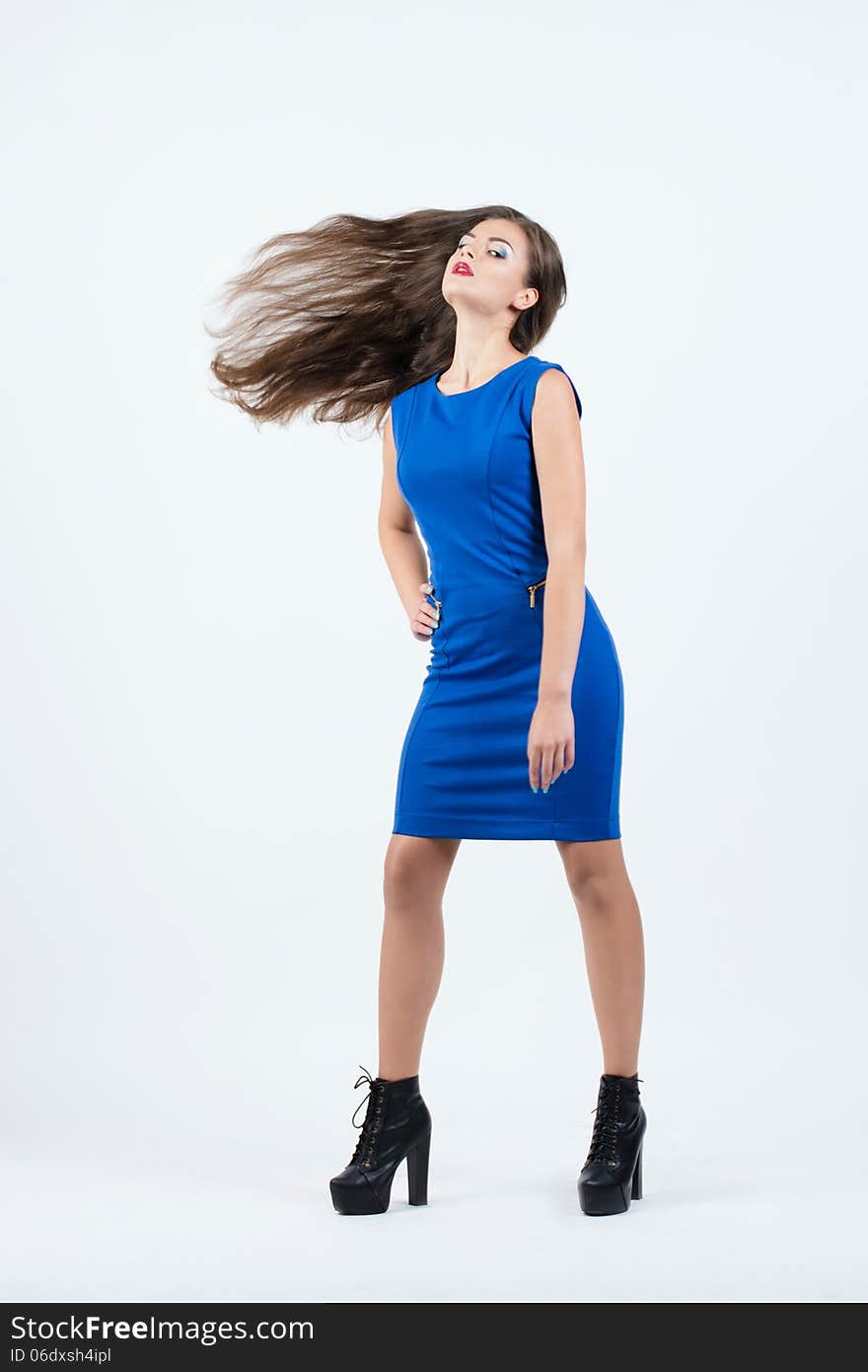 Beautiful stylish girl with long hair on white background