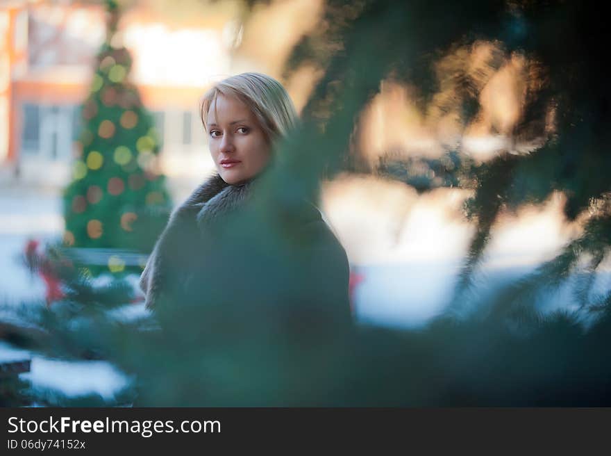 Beautiful blonde woman with long hair in a brown fur coat. Beautiful blonde woman with long hair in a brown fur coat