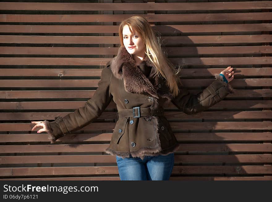 Beautiful blonde woman with long hair in a brown fur coat. Beautiful blonde woman with long hair in a brown fur coat