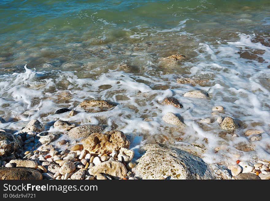 Ukraine, peninsula of Crimea, Sea coast on the Black Sea, large and small pebbles, large boulders, sea waves. Ukraine, peninsula of Crimea, Sea coast on the Black Sea, large and small pebbles, large boulders, sea waves