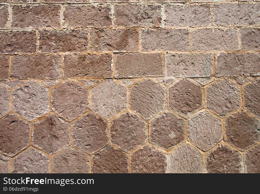 A detailed background of a stone tile wall. A detailed background of a stone tile wall.