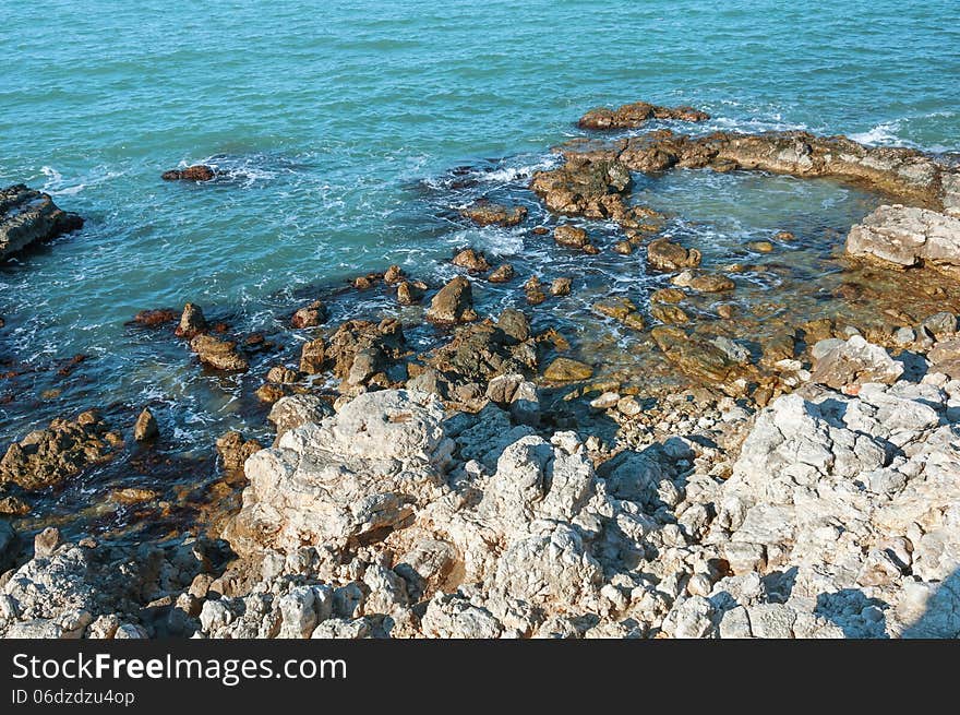 Ukraine, peninsula of Crimea, Sea coast on the Black Sea, large and small pebbles, large boulders, sea waves. Ukraine, peninsula of Crimea, Sea coast on the Black Sea, large and small pebbles, large boulders, sea waves