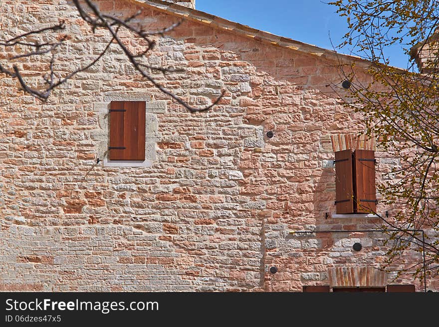 The old Church of red bricks in the mountains of Italy summer day. The old Church of red bricks in the mountains of Italy summer day