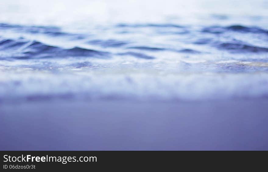 Sea waves closeup with shallow depth of field