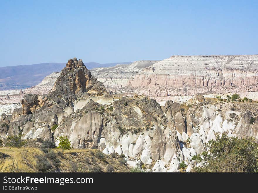 Warm Glow of Sunset on the Fairy Chimneys of Cappadocia, Popular Travel Destination in Central Turkey. Red rose valley. Warm Glow of Sunset on the Fairy Chimneys of Cappadocia, Popular Travel Destination in Central Turkey. Red rose valley.