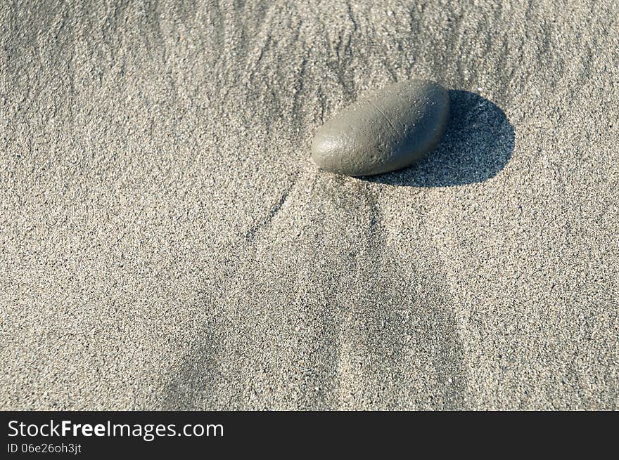 Pebble on beach sand