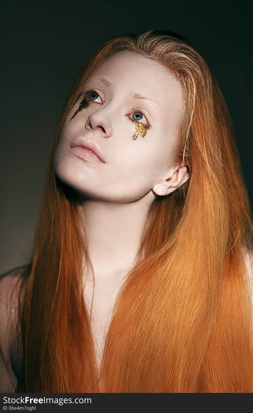 Funny Young Woman with White Makeup and Gold Tears. Funny Young Woman with White Makeup and Gold Tears