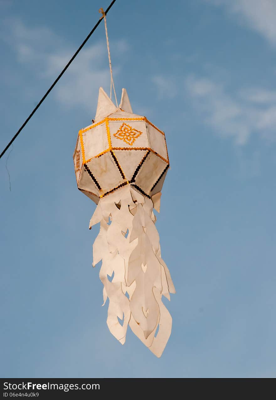 White paper star on blue sky